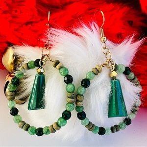 Green beaded hoop earrings. $10